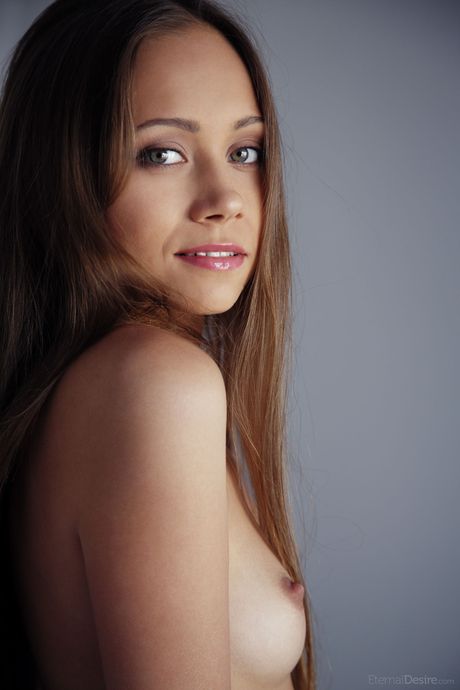 Bashful teen Tristana A removes red lingerie to pose nude on her bed