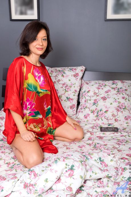 Sexy brunette Angel A shows her hairy pussy and toes in a solo