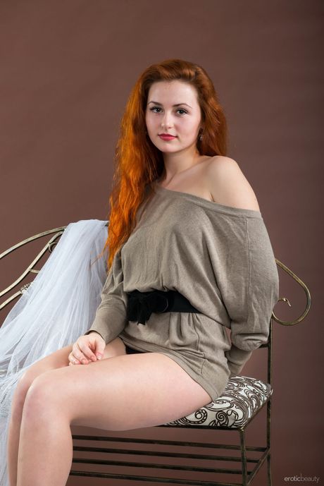 Lovely teen Sascha A gets naked on a table with grace