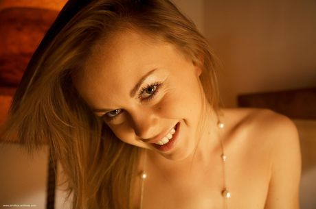 Solo girl with long hair and a nice ass gets naked in black boots