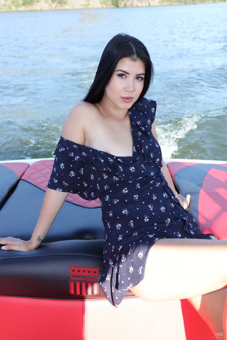 Petite teen Lady Dee strips and exhibits nudity on a yacht in the water