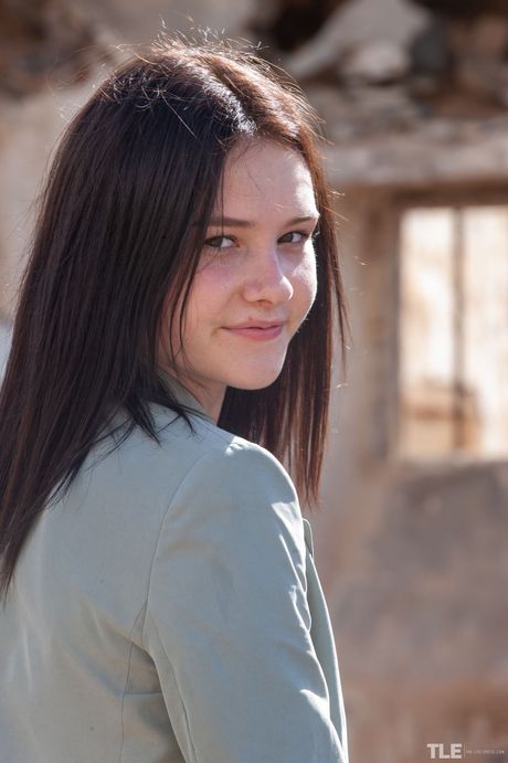 Young brunette Matty gets naked before masturbating in a derelict building