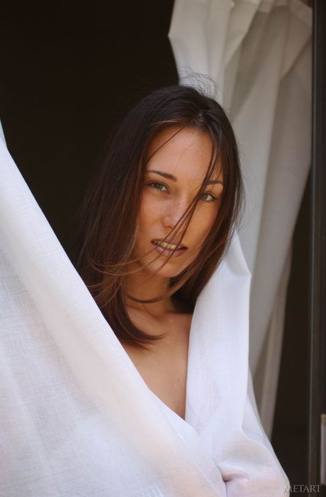 Young brunette Brandi removes her glasses and lingerie to pose nude