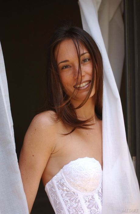 Young brunette Brandi removes her glasses and lingerie to pose nude