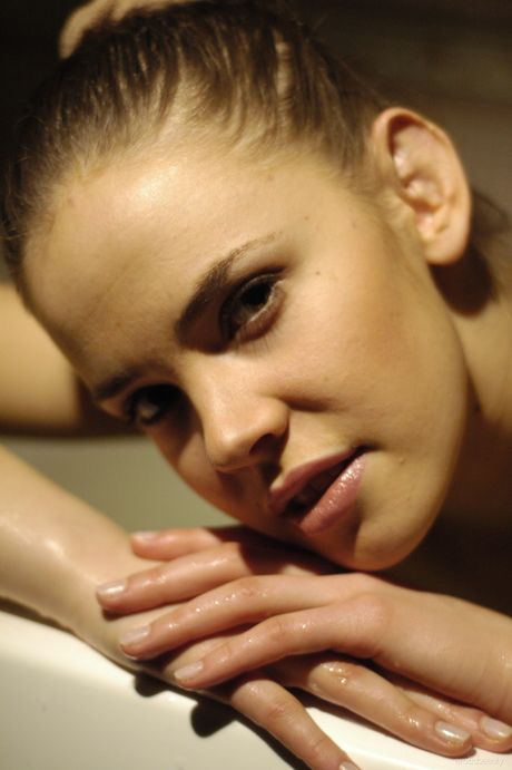 Thin teen Daria poses nude in the bathroom and shows her tiny tits