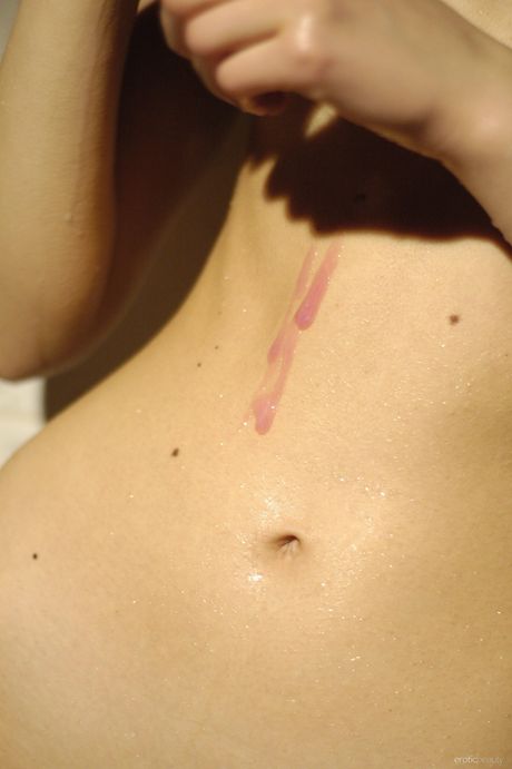 Thin teen Daria poses nude in the bathroom and shows her tiny tits