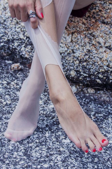 Lesma shows off her beautiful, slender curves in minimal studded leather