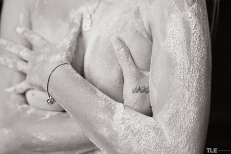 Naked brunette Katia B spreads her legs wide open to show her pink pussy