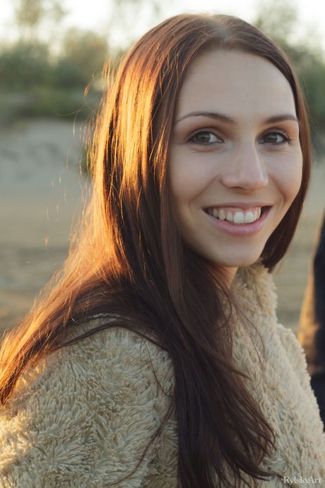 Charming teen Gemma shows off her beautiful body in the nude on a balcony