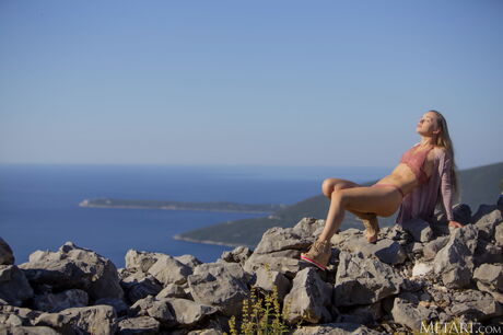 Delicate teen Milena D gets naked on a rocky beach with conviction