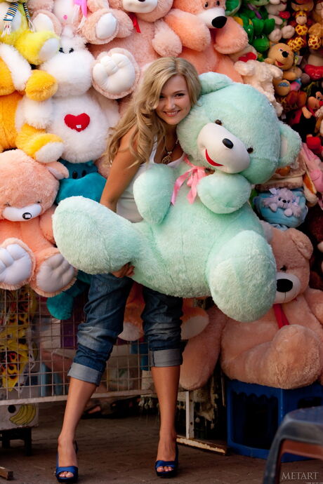 Sexy blonde Elisa A strips in the meadow & shows her big tits & hot ass