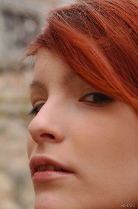 Sexy redhead Ulya I in black stockings & bare feet posing nude in the wild