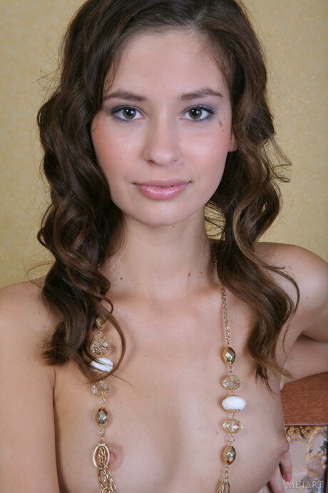 Innocent teen Irina J models totally naked with self-assuredness during a solo