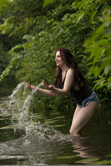 Slender teen Lisa Musa bares it all while in a swimming pool