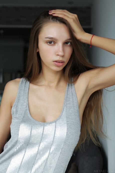 Engaging teen Elin removes her lingerie to model naked in high heels