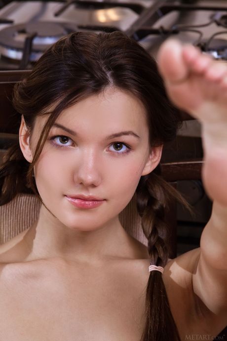 Love Hairy: Adorable teen Iva removes her pigtails and clothes to pose nude in the kitchen