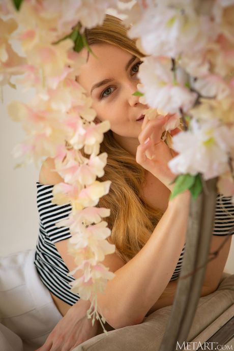 Young blonde Arya takes off everything on a swing chair in a solo shoot