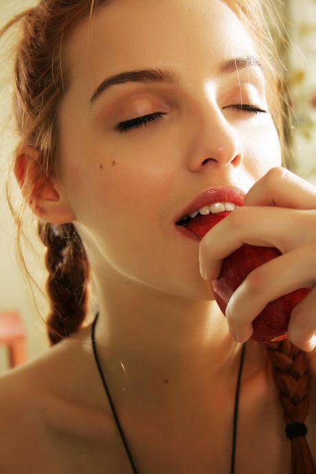 Redheaded teen Kira W gets naked in pigtails and heels