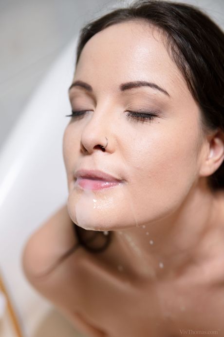 Delicate teen Dolly Diore masturbates with a huge dildo in the bathroom