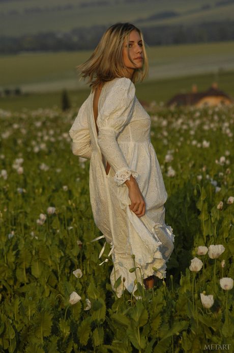 Cute blonde teen Iveta B gets naked in an enticing manner