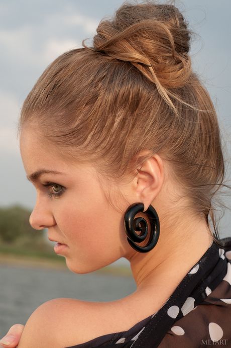 Lean teen Bridgit A gets naked and poses in the water