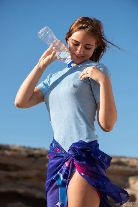 Ukrainian babe Oxana Chic strips and masturbates outdoors