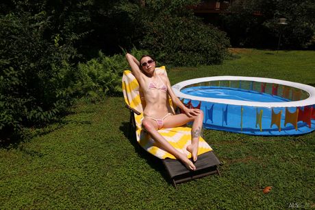 Lean teen Brooke Johnson pisses on the deck after removing her bikini