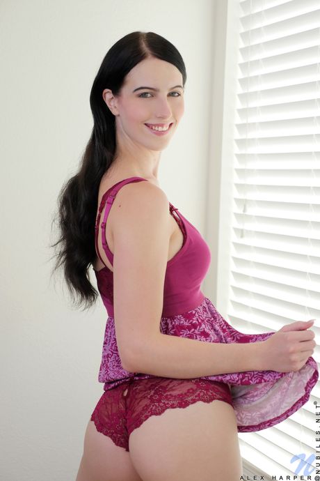 Alex Harper takes off her dress and panties and plays with her pink pussy