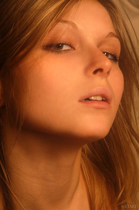 Ukrainian girl Cassandra A displays her tiny tits and poses nude