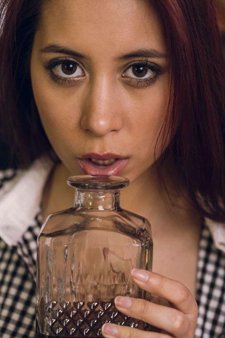 Asian teen Paula Shy removes her lingerie before masturbating on a desk