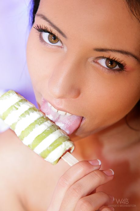 Teen model Bailey removes her clothes and socks to pose nude in a dungeon