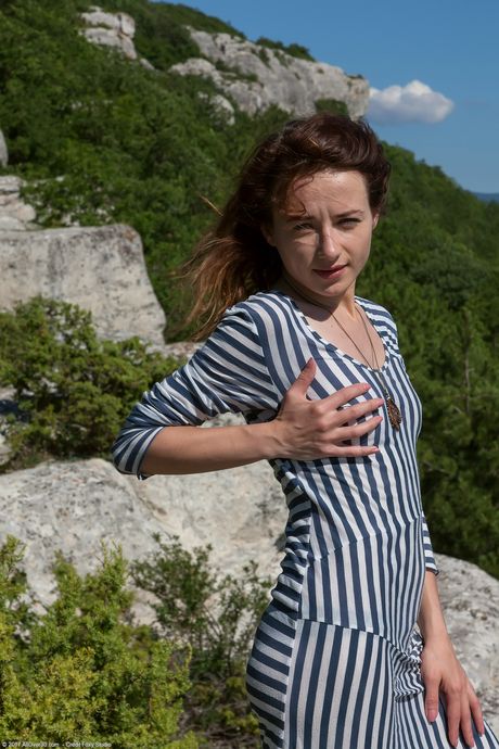 Amateur redhead Shaya exposes her hairy pussy and ass outdoors