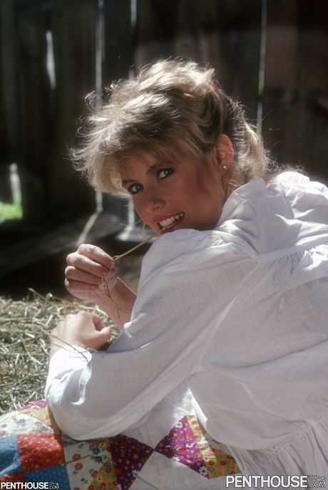 Blonde centerfold Francis McAmish displays her big tits and hot ass outdoors