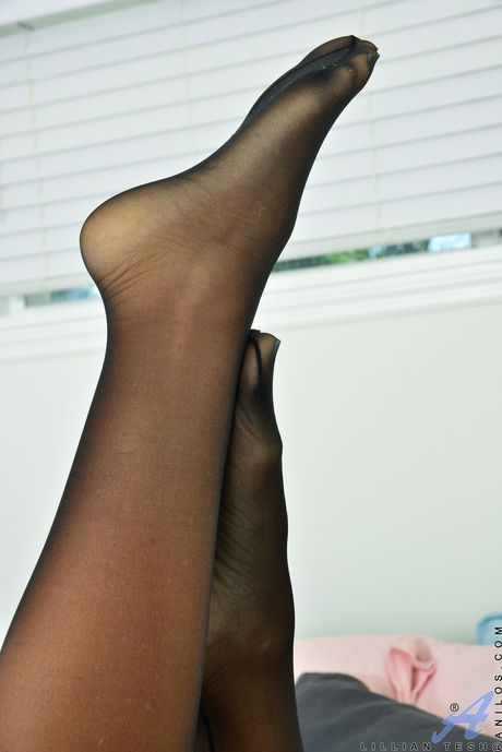 Mature blonde Lillian Tesh shows her big tits and shaved pussy in stockings