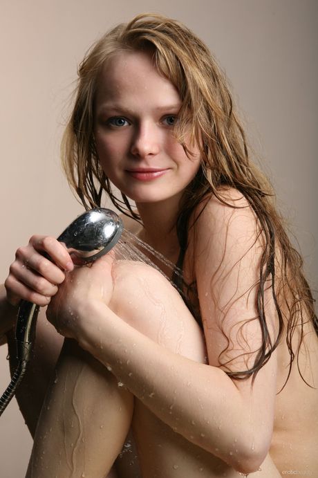 Gorgeous teen Mia C gets wet while taking a shower in the bathroom