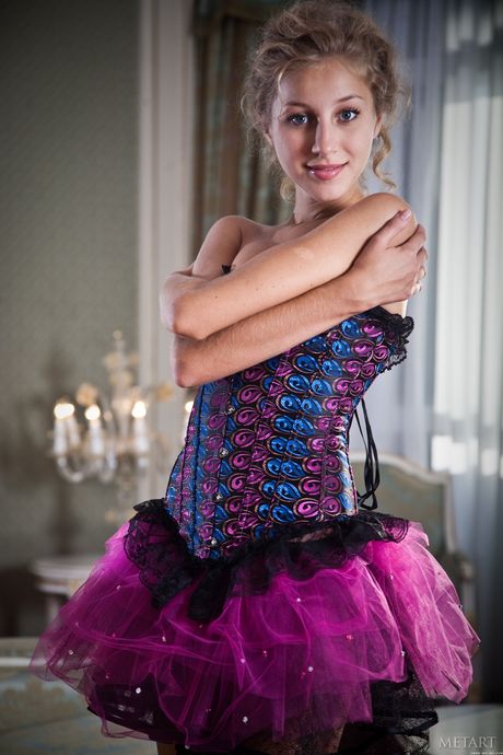 Skinny blonde Erika F gets naked in an enticing manner