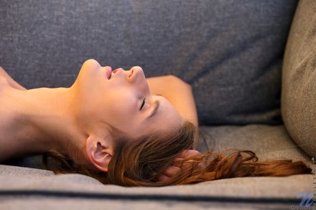 Brunette college girl Mikki gets nude on a patio chair to masturbate