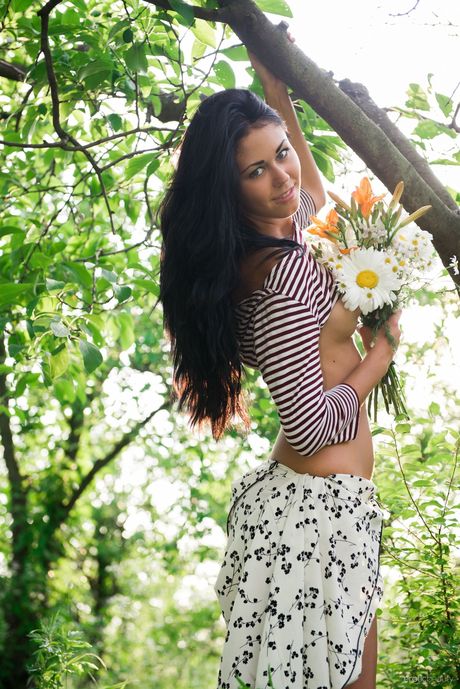 Lean teen Macy B strips and poses naked in the garden