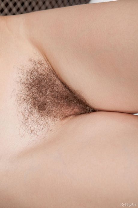 Young redhead Orabelle Koivu gets naked in a bathroom before taking a shower