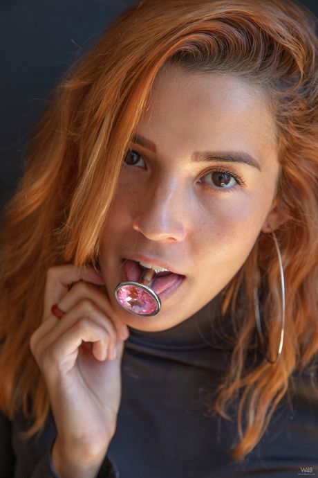 Sexy redhead Agatha Vega sticks a dildo in her tight butt and pussy