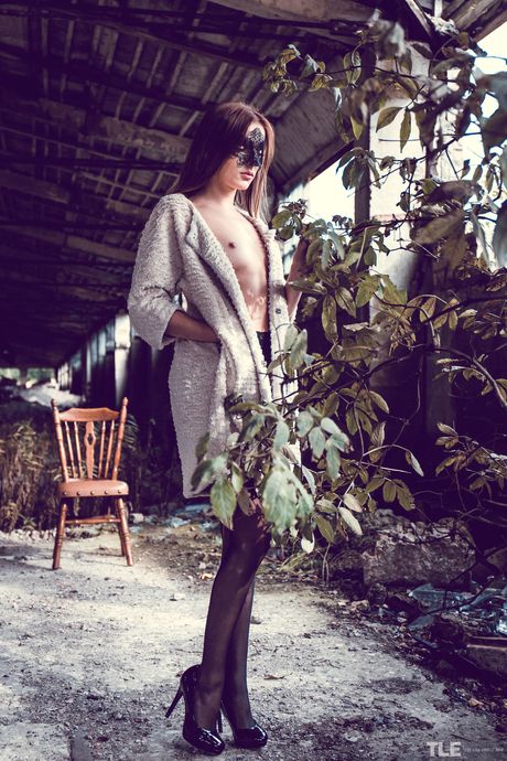 Solo girl Marlyn A removes a mask and lingerie to pose nude in stockings