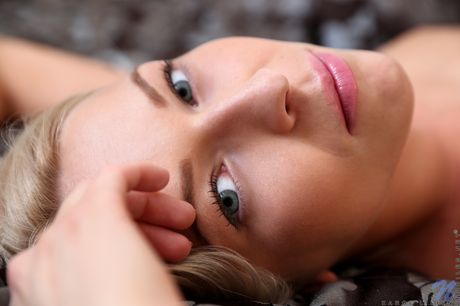 Skinny blonde Karol Lilien strips and poses in her high heels