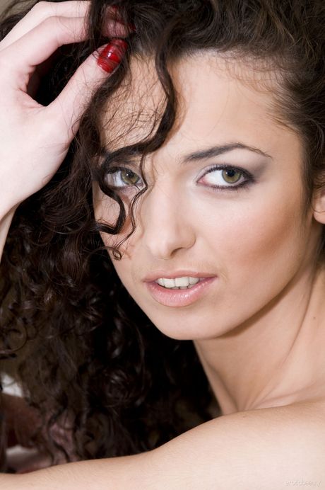 Sexy Ukrainian babe Karina G strips and poses naked in the bathroom