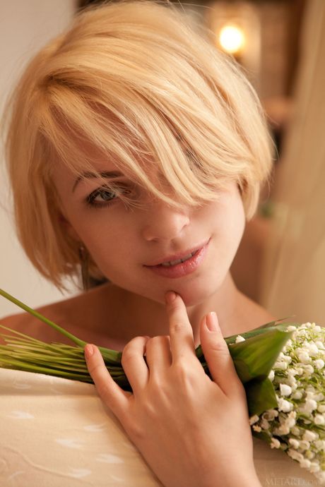 Slender teen Avrora A shows her tiny tits and poses naked