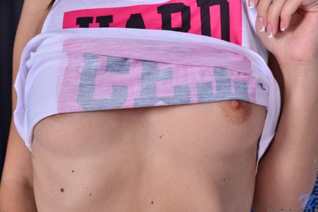 Svelte teen Jasmine Jazz spreads her pink pussy wide open on a bed