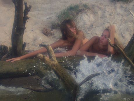 Slender teenage babes with tiny tits posing naked on the beach
