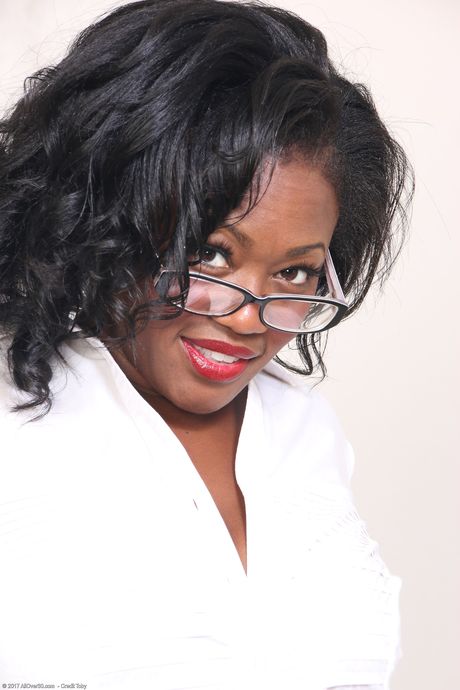 Black secretary Sunny strips naked on her desk and shows her big ass