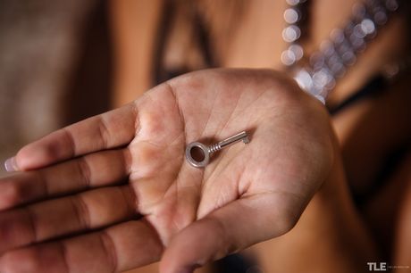 Sexy brunette Serina Gomez removes her lingerie and pantyhose to masturbate