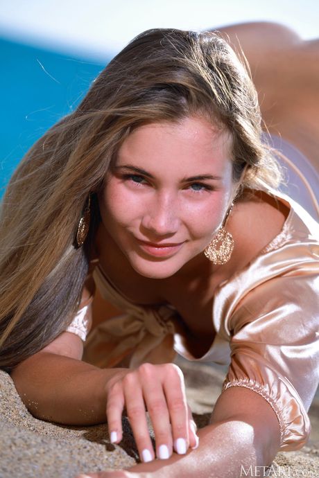 Adorable teen Mary Rock strips down on a sandy beach