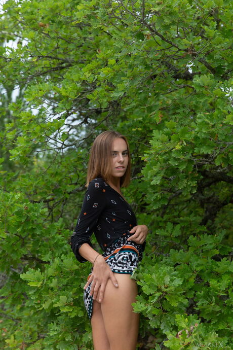 Lean teen Gracie fingers her pussy after getting naked on a road